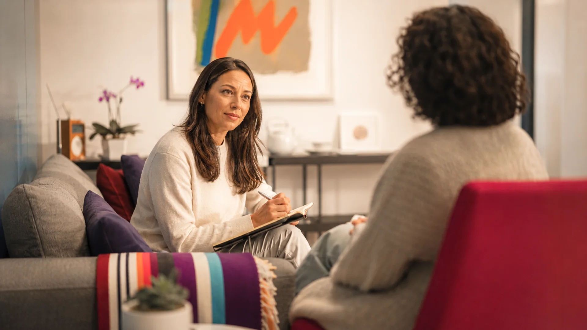 Therapist consulting with a patient in a calm office