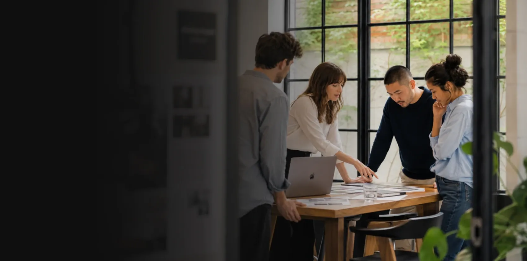 Business strategy team collaborating around a table